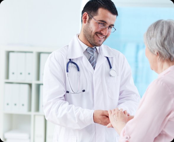 Doctor shaking hands with elderly patient — clinical care coordination